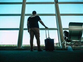 man holding luggage bag