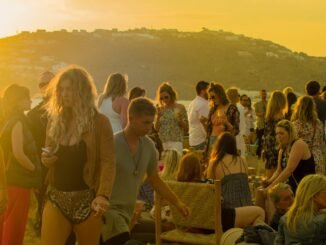 crowd of people gathering during golden hour
