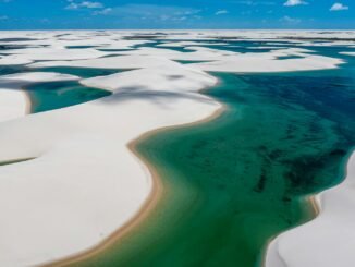 aerial view of the white sand dunes and water