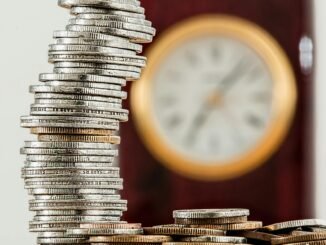selective focus photo of stacked coins