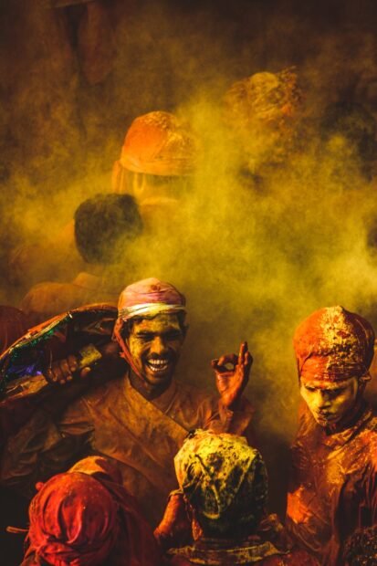 people covered in colored powder